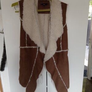A fun faux fur and leather vest by "Slonl"